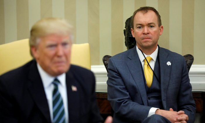 Mick Mulvaney (R) listens as then-President Donald Trump meets with members of the Republican Study Committee at the White House in Washington, U.S. on March 17, 2017.  (Jonathan Ernst/Reuters)
