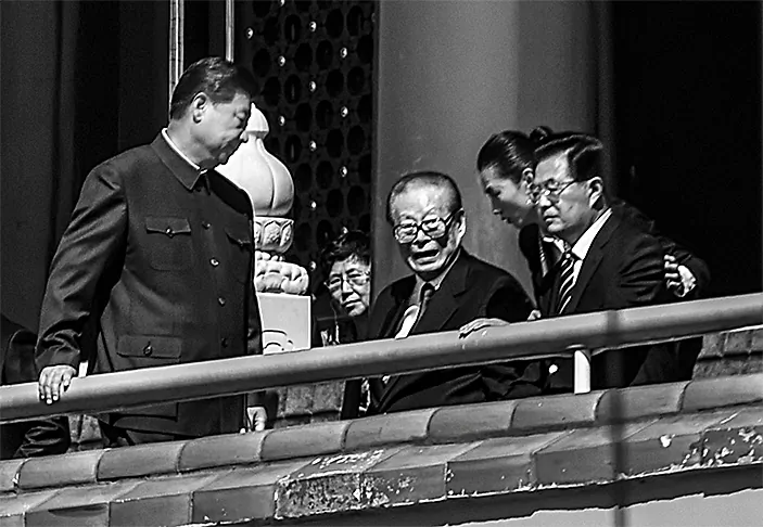 (Left to right) Chinese leader Xi Jinping, and former Chinese Communist Party leaders Jiang Zemin and Hu Jintao attend a military parade at Tiananmen Square in Beijing on Sept. 3, 2015. (Greg Baker/AFP/Getty Images)