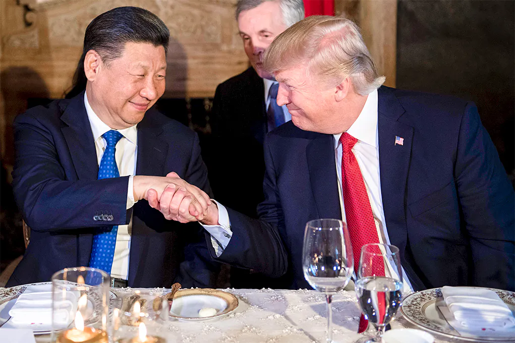 President Donald Trump and Chinese leader Xi Jinping shake hands during dinner at the Mar-a-Lago estate in West Palm Beach, Florida, on April 6, 2017. (JIM WATSON/AFP/Getty Images)