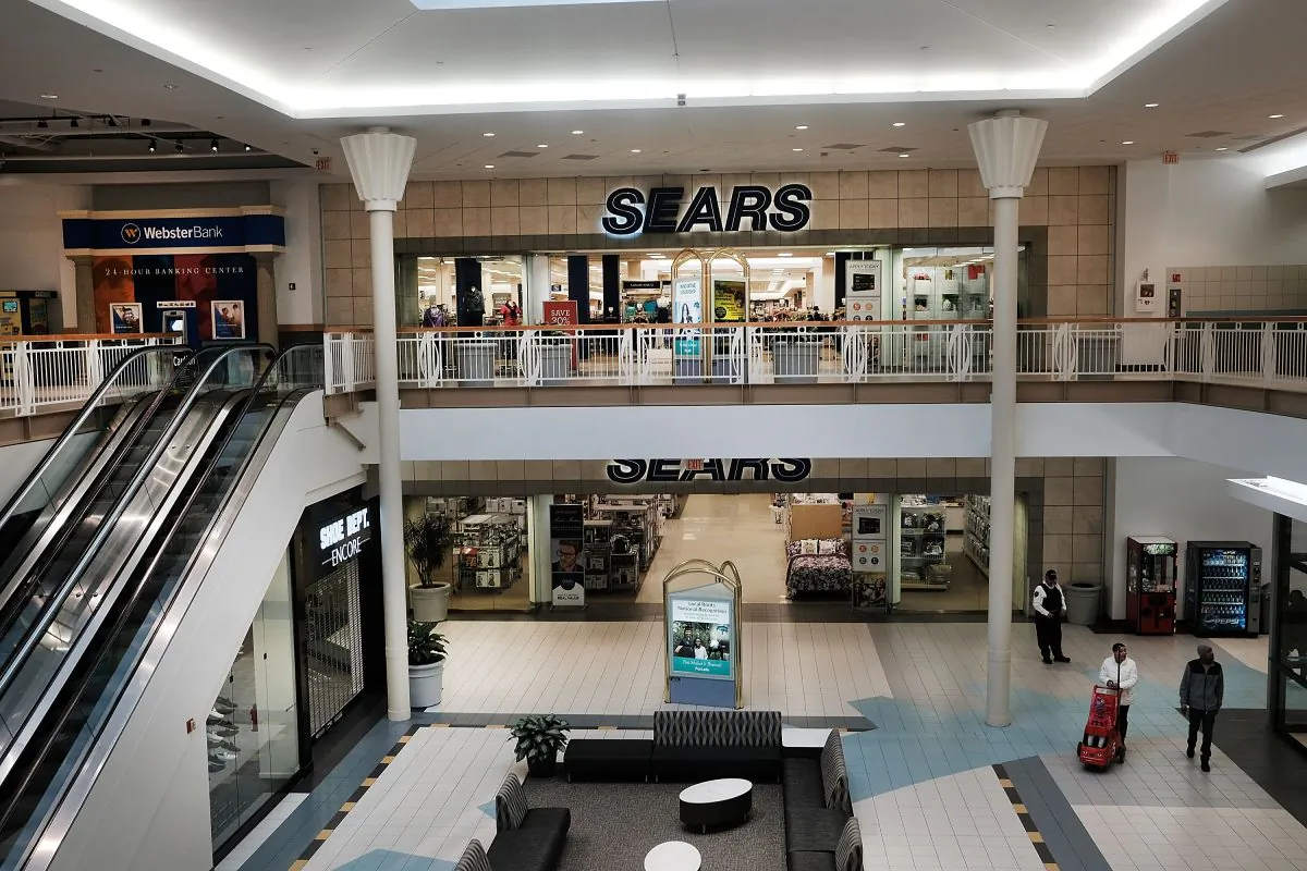 WATERBURY, CT - MARCH 28: People walk through a nearly empty shopping mall on March 28, 2017 in Waterbury, Connecticut. As consumers buying habits change and more people prefer to spend money on technology and experiences like vacations over apparel, shopping malls across the country are suffering.In the last decade dozens of malls have closed as retailers like JCPenney, Macy's and Sears, known as 'anchor stores,' close hundreds of locations do to falling sales. Real estate firm CoStar are projecting that nearly 25% of American malls are in danger of losing their anchors stores. (Photo by Spencer Platt/Getty Images)
