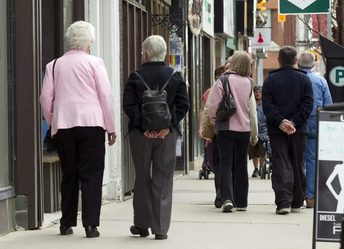 Senior citizens make their way along a street in Peterborough, Ont., on May 7, 2012. (Frank Gunn/The Canadian Press)