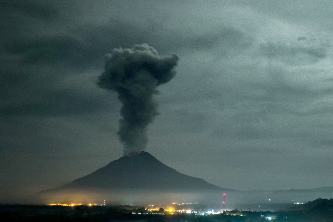 Mount Sinabung volcano spews thick volcanic ash as seen from Beganding village in Karo, Indonesia, on May 2, 2017. Sinabung roared back to life in 2010 for the first time in 400 years. (TIBTA PANGIN/AFP/Getty Images)