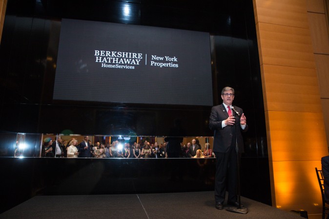 Peter Turtzo, Senior Vice President at Berkshire Hathaway HomeServices speaks to guests during the celebration of their grand opening location in New York. (Benjamin Chasteen/The Epoch Times)