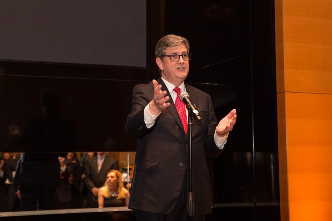 Peter Turtzo, Senior Vice President at Berkshire Hathaway HomeServices speaks to guests during the celebration of their grand opening location in New York. (Benjamin Chasteen/The Epoch Times)