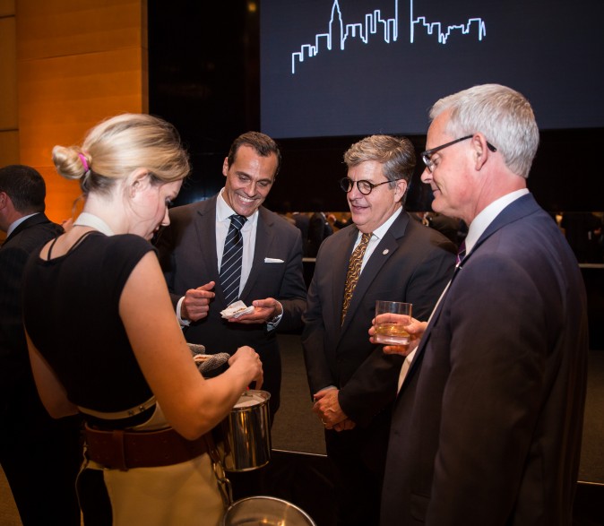 Guests and real estate agents celebrate the opening of Berkshire Hathaway HomeServices New York Properties hosted at the Four Seasons hotel in Manhattan on April 26, 2017. (Benjamin Chasteen/The Epoch Times)