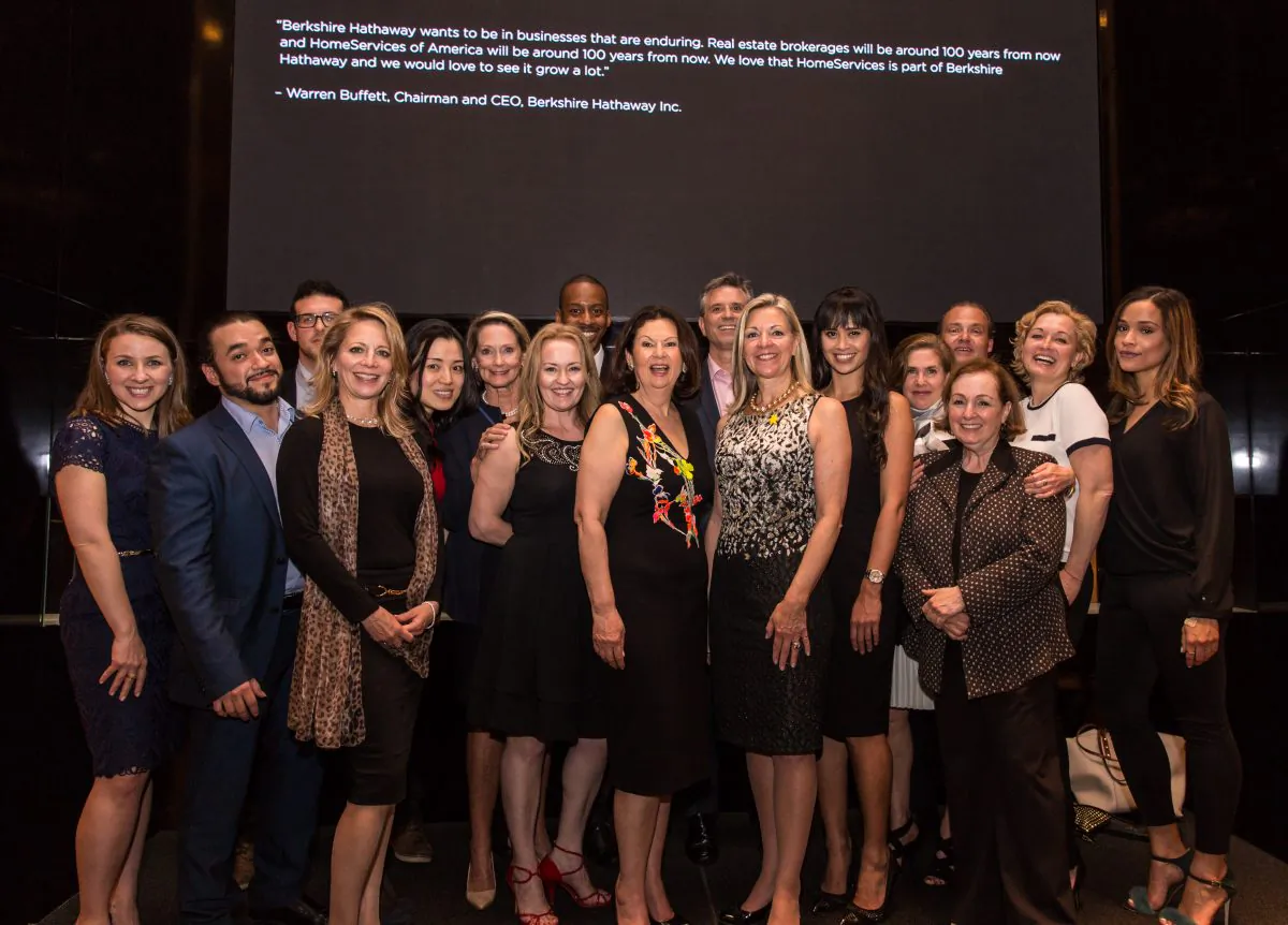 Guests and real estate agents celebrate the opening of Berkshire Hathaway HomeServices New York Properties hosted at the Four Seasons hotel in Manhattan on April 26, 2017. (Benjamin Chasteen/The Epoch Times)