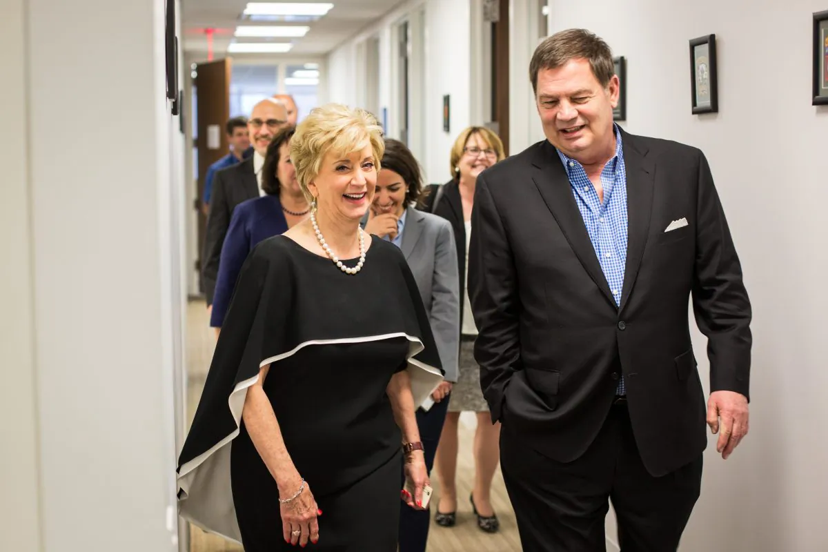 Linda McMahon, administrator of the Small Business Administration,  talks to Lawrence K. Doll chairman of Drexel Hamilton, an institutional broker-dealer that offers employment opportunities to disabled veterans, on May 2, 2017. (Benjamin Chasteen/The Epoch Times)