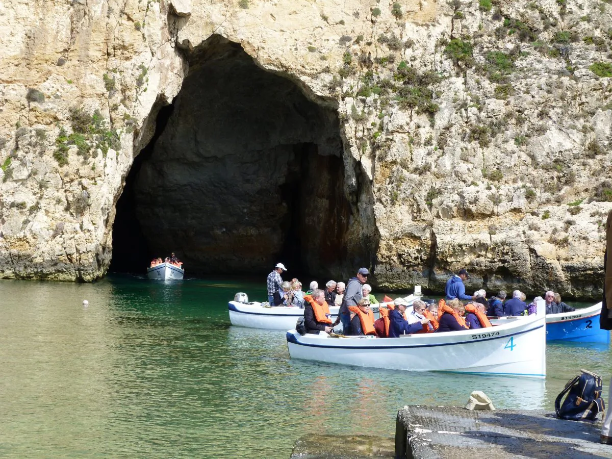 Tourist boats come and go from the Blue Grotto, a series of sea caverns in Gozo. (Barbara Angelakis)