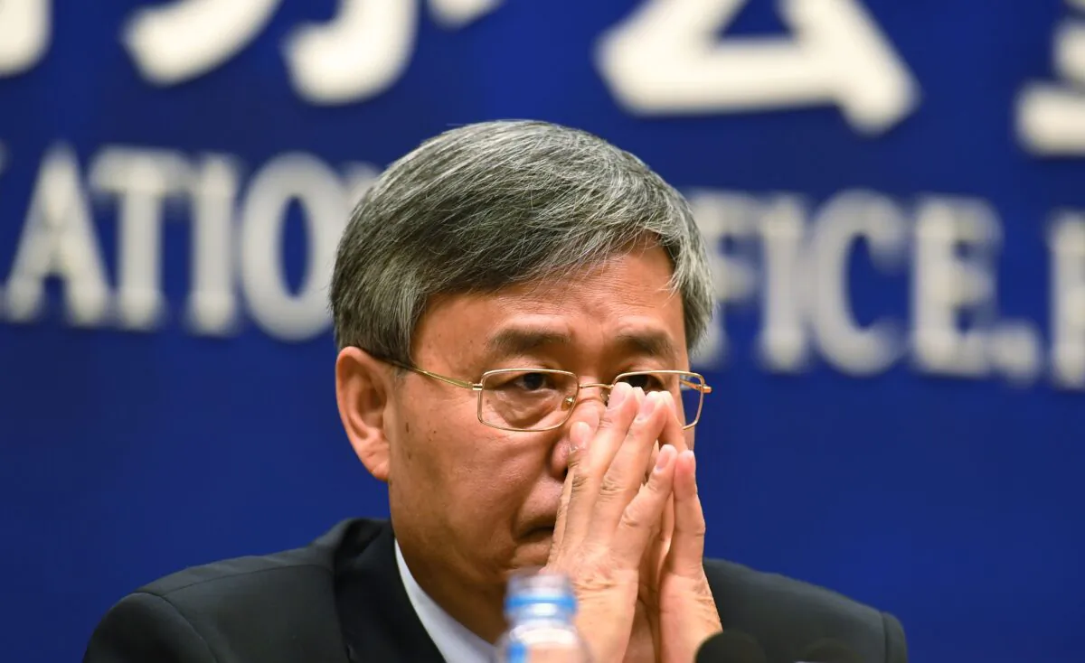 Guo Shuqing, Chairman of the China Banking Regulatory Commission, listens to a question during a press conference in Beijing on March 2, 2017. (Greg Baker/AFP/Getty Images)