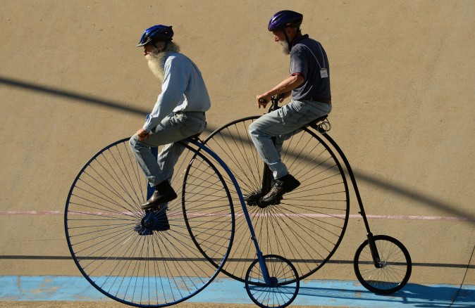 Men ride penny farthing bicycles during the 2017 Sydney Classic Bicycle Show at Canterbury Velodrome in Sydney, Australia, on May 6. The Sydney Classic Bicycle Show is in its fifth year and is run by the Dulwich Hill Bicycle Club, which was started in 1908 and showcases bicycles from the 1800s to the present day. (PETER PARKS/AFP/Getty Images)