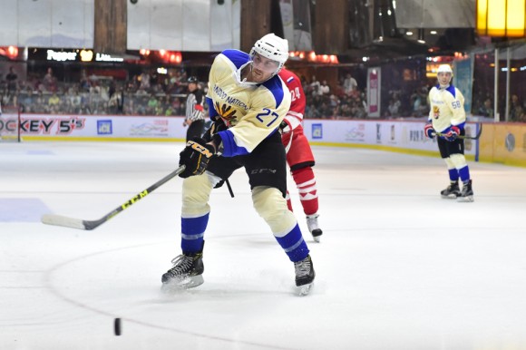 Steven Johnston of Pandoo Nation slots the puck home to seal the final 2-1 against Totachi CCCP on May 6, 2017. (Bill Cox/Epoch Times)
