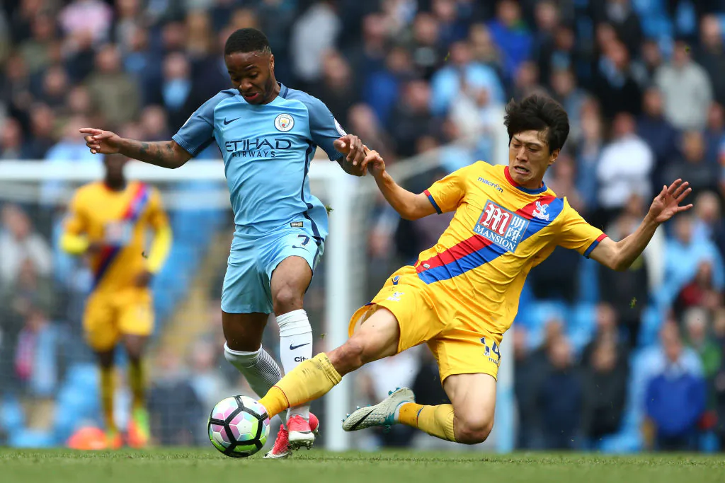Raheem Sterling of Manchester City and Chung-yong Lee of Crystal Palace battle for possession during the Premier League match between Manchester City and Crystal Palace at the Etihad Stadium on May 6, 2017 in Manchester, England. (Dave Thompson/Getty Images)