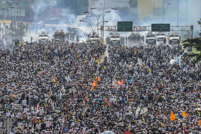 Opposition activists march along Francisco Fajardo highway during a protest against President Nicolas Maduro in Caracas, on May 10, 2017. Clashes between protesters and riot cops have left 36 people dead and hundreds injured since the unrest erupted on April 1, according to authorities. (FEDERICO PARRA/AFP/Getty Images)