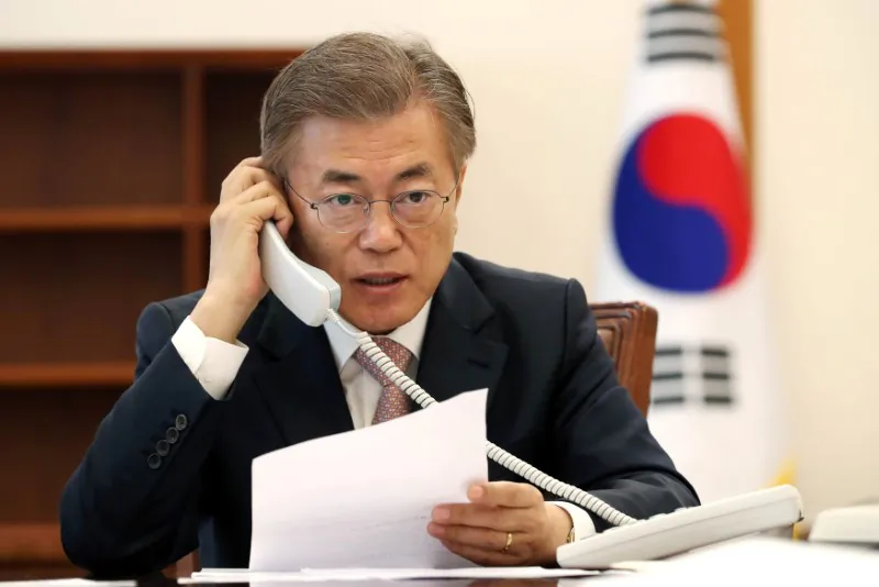 South Korean President Moon Jae-in speaks with Chinese leader Xi Jinping by telephone at the Presidential Blue House in Seoul, South Korea in this handout picture provided by the Presidential Blue House and released by Yonhap on May 11, 2017. (Blue House/Yonhap via REUTERS)
