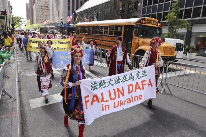 Falun Gong Practitioners from Ukraine march in the World Falun Dafa Day parade in New York on May 12, 2017. (Edward Dye/The Epoch Times)
