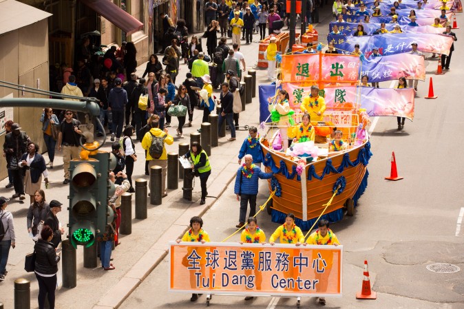 Thousands of Falun Gong practitioners march in a parade along 42nd Street in New York for World Falun Dafa Day on May 12, 2017. (Evan Ningn/The Epoch Times)