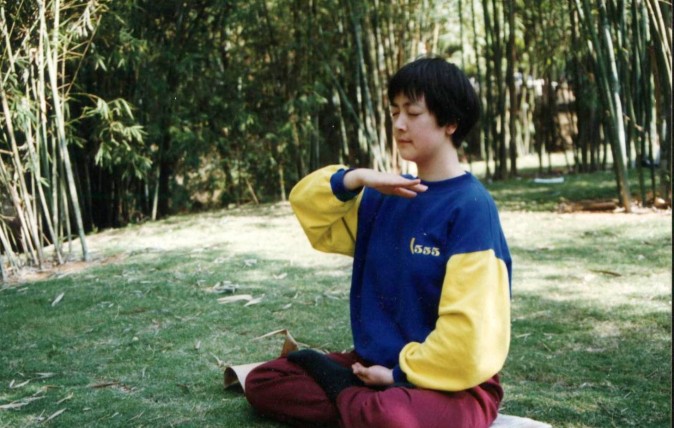 Jennifer meditating in 1998 in a park in Shenzhen City, China. (courtesy Jennifer Zeng)