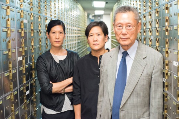 Thomas Sung and two of his daughters as they appear in the documentary,