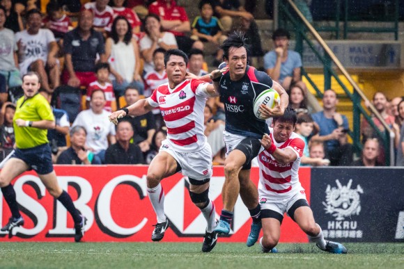 Hong Kong winger Salom Yiu Kam shing looks to break the Japan defense. (Dan Marchant)