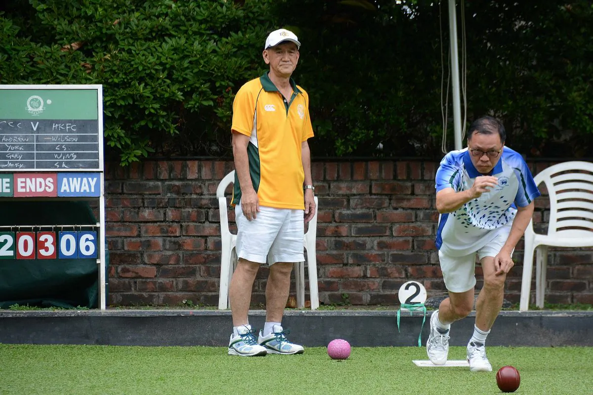 SK Ng (delivering) from Hong Kong Football Club on his way to defeating Jacky Wong of Craigengower Cricket Club in their league meeting last Saturday, May 13, 2017. CCC won the game 6:2 to maintain second place on the table. (Stephanie Worth)