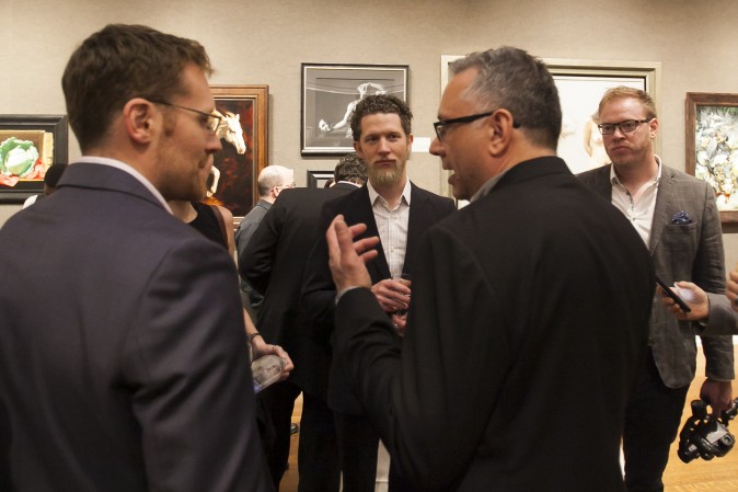 Artist Joshua LaRock (C) at the reception of 12th International ARC Salon Exhibition at the Salmagundi Club in Manhatan, New York, on May 12, 2017. (Milene Fernandez/The Epoch Times)