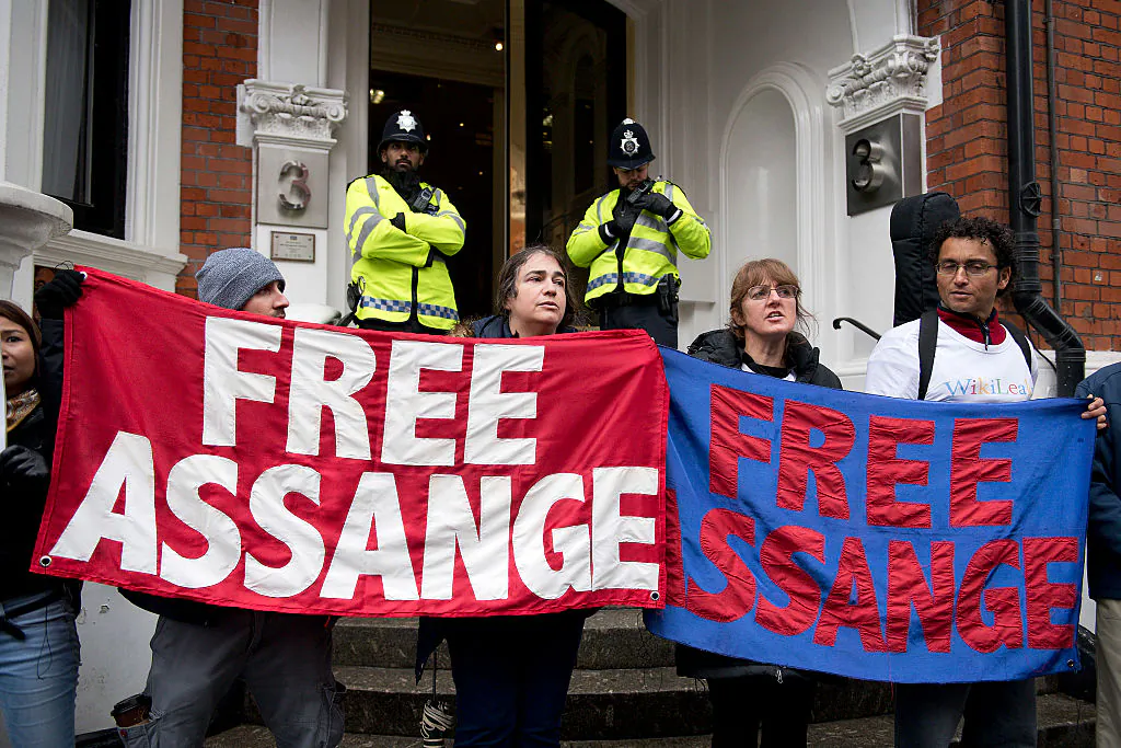 Protesters hold banners that read "Free Assange" outside the Ecuadorian Embassy in London on Nov. 14, 2016. (JUSTIN TALLIS/AFP/Getty Images)