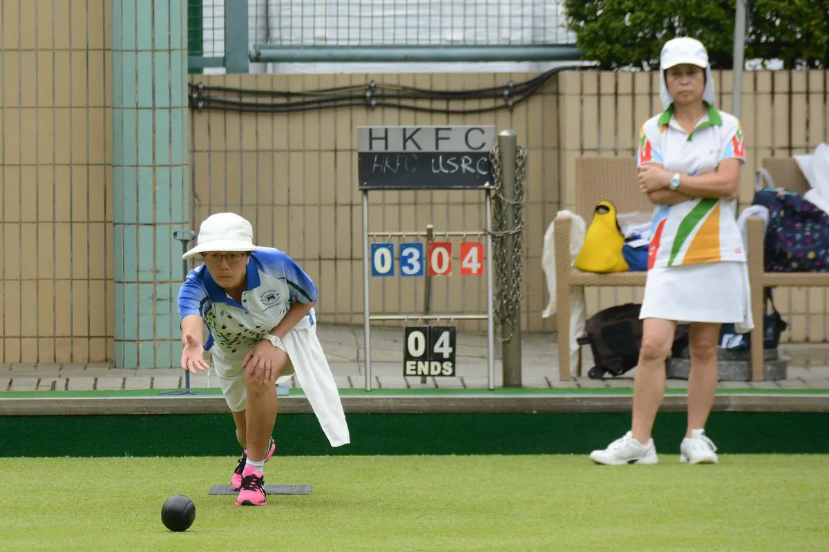 Wanis Sze (delivering) from Hong Kong Football Club on her way to defeating Cindy Robinson of United Service Recreation Club in their league meeting on Saturday, May 20. The 8-0 victory allowed HKFC to move within two points of league leaders Island Lawn Bowls Club. (Stephanie Worth)