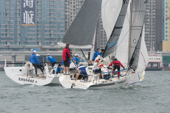 'Rampage II' just gets the inside line to the bottom mark ahead of 'Gambit' in Race 1 of the RHKYC Spring Regatta on Saturday May 20. 2017. (Bill Cox/Epoch Times)
