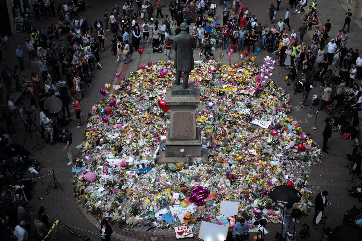 A carpet of floral tributes to the victims and injured of the Manchester Arena bombing covers the ground in St. Ann's Square in Manchester, UK, on May 25, 2017. (Christopher Furlong/Getty Images)