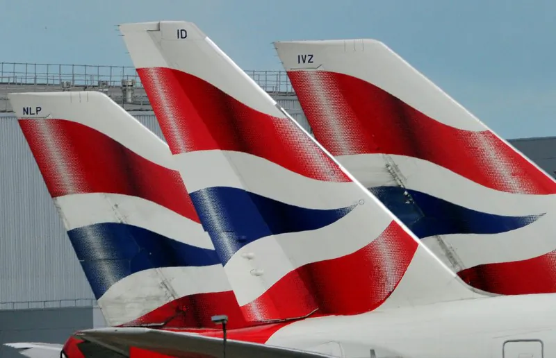 British Airways logos are seen on tailfins at Heathrow Airport in west London, Britain. (file, REUTERS/Toby Melville/Files)