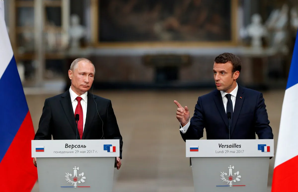 French President Emmanuel Macron (R) and Russian President Vladimir Putin (L) give a joint press conference at the Chateau de Versailles before the opening of an exhibition marking 300 years of diplomatic ties between the two countries in Versailles, France, May 29, 2017.   REUTERS/Philippe Wojazer