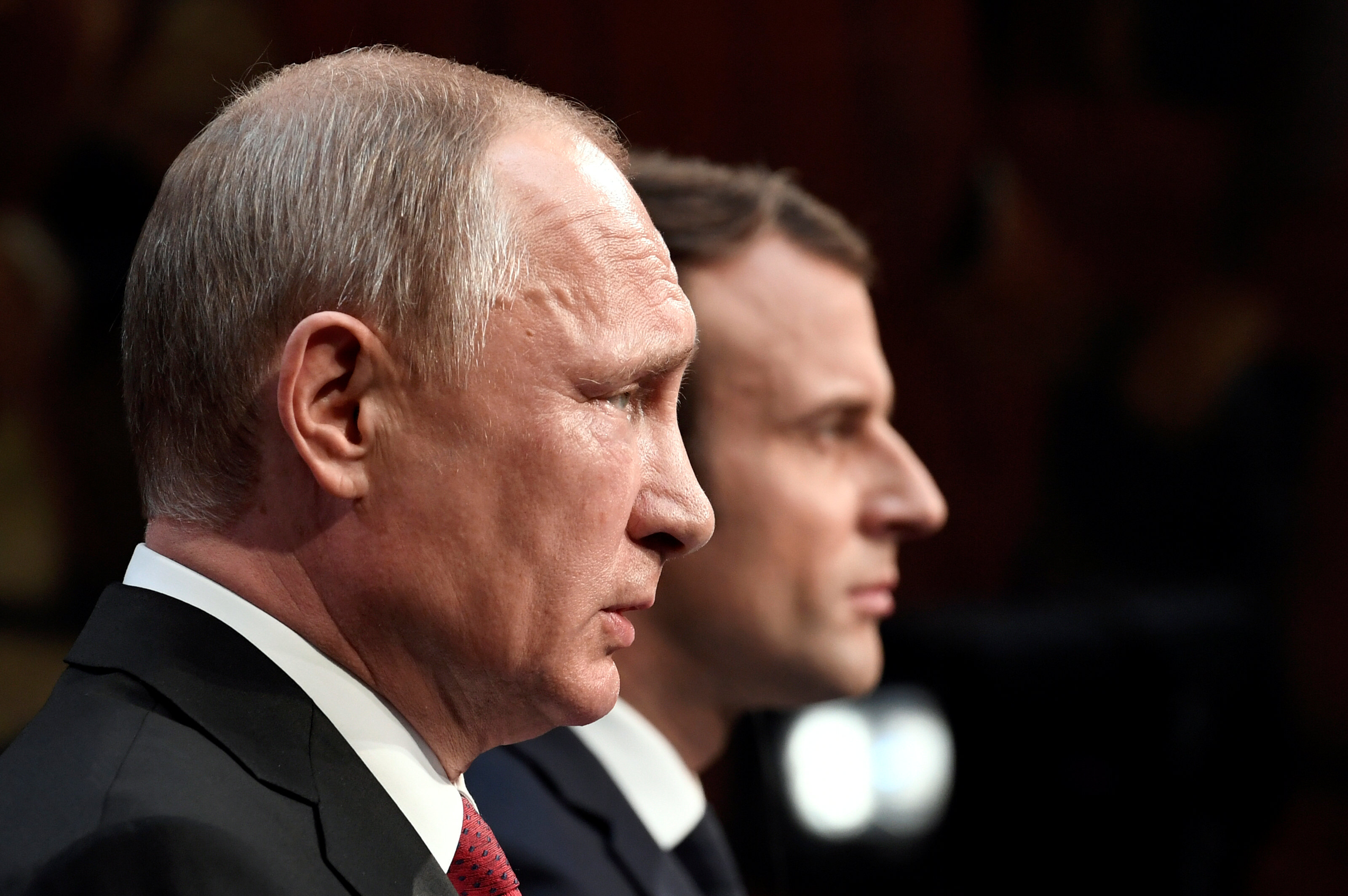French President Emmanuel Macron (R) and Russian President Vladimir Putin (L) give a joint press conference at the Chateau de Versailles before the opening of an exhibition marking 300 years of diplomatic ties between the two countries in Versailles, France on May 29, 2017. (REUTERS/Stephane De Sakutin/Pool)