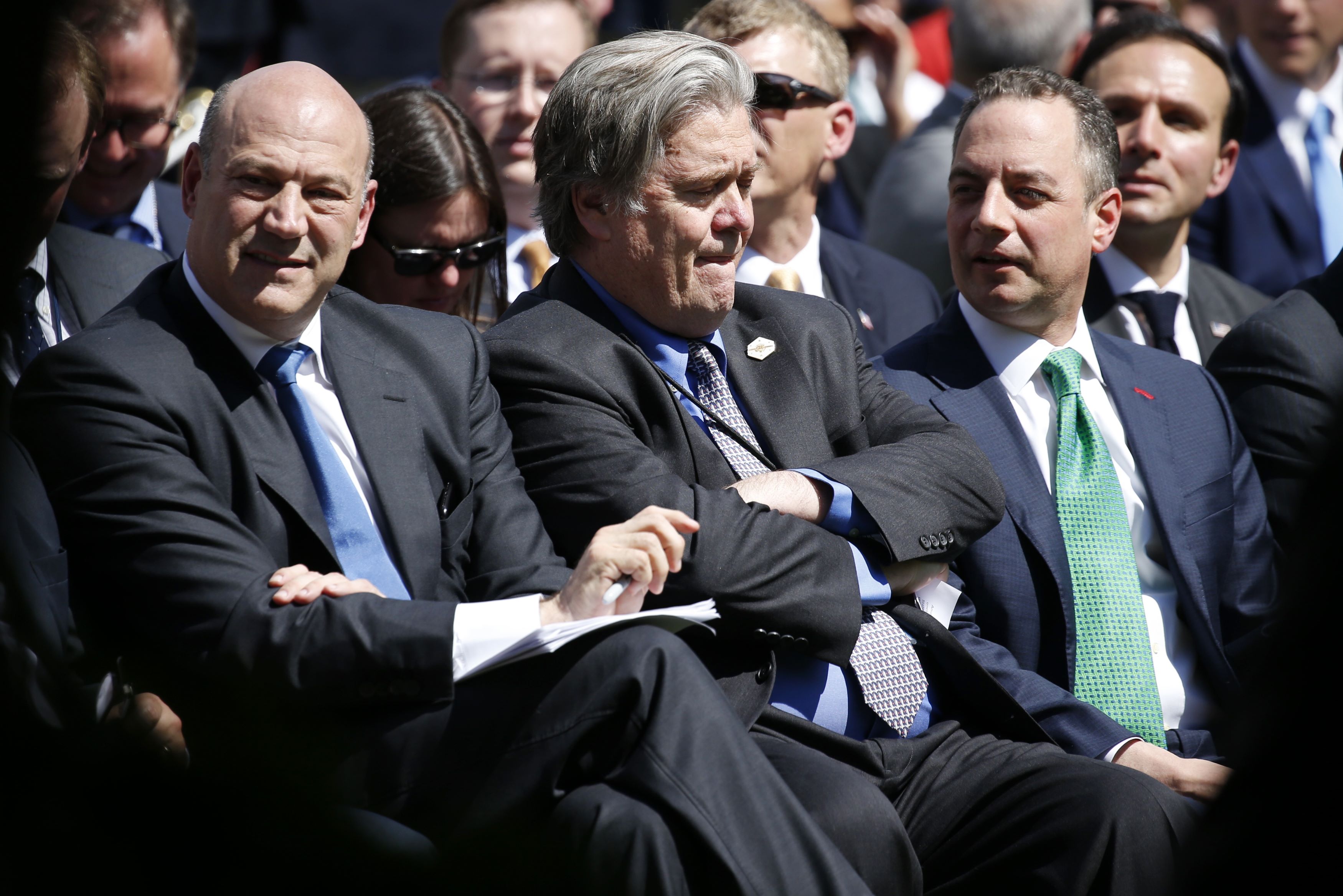 Director of the White House National Economic Council Gary Cohn, White House Chief Strategist Stephen Bannon and Chief of Staff Reince Priebus (L-R) wait in the Rose Garden prior to President Donald Trump announcing his decision on whether the U.S. will remain in the Paris Climate Agreement, at the White House in Washington on June 1, 2017. (REUTERS/Joshua Roberts)
