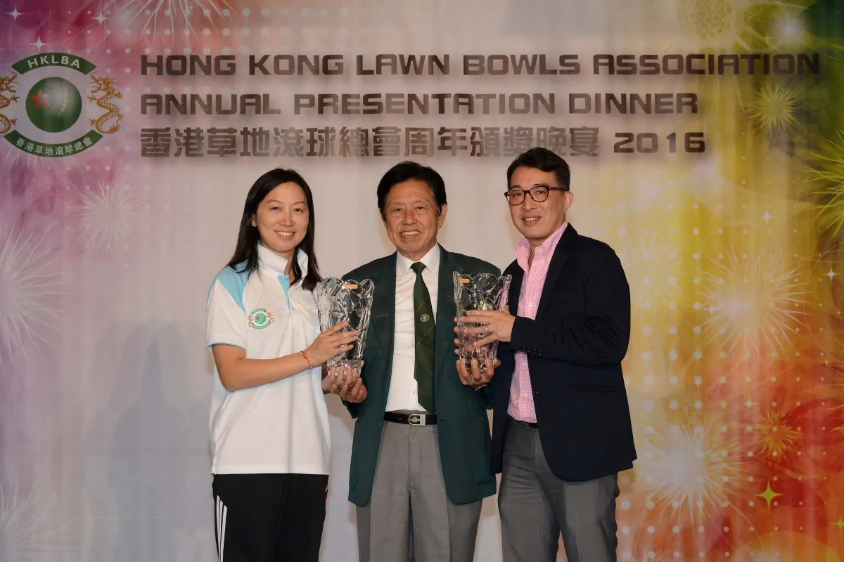 Vincent Cheung (middle) the President of the Hong Kong Lawn Bowls Association, presents the Bowler of the Year award to Dorothy Yu (left) and Chadwick Chen at the Annual Prize Presentation Dinner organised by the Hong Kong Lawn Bowls Association last Friday, May 26, 2017 (Stephanie Worth)