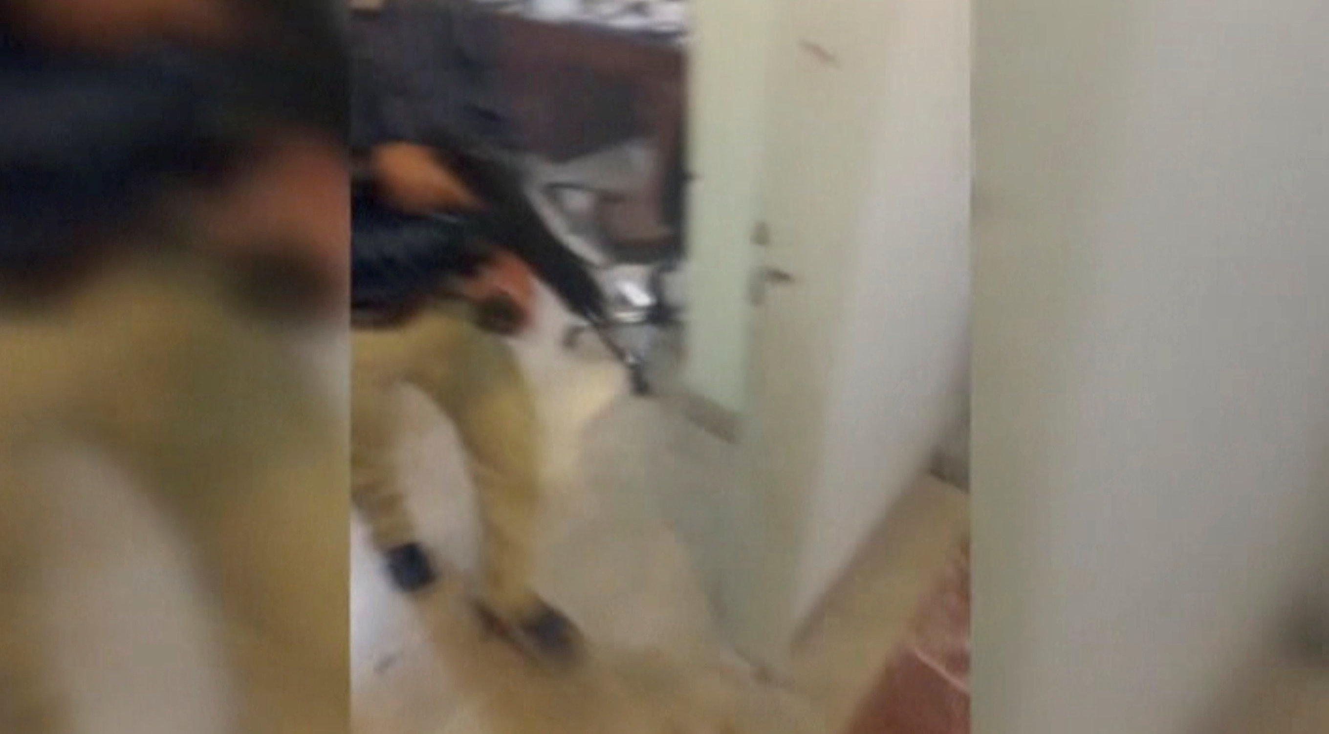 A still image taken from a video released on the internet by ISIS-affiliated Amaq News Agency, on June 7, 2017, purports to show a man with a gun walking in office said to be inside Iranian parliament in Tehran, Iran. (Social Media Website via Reuters TV)