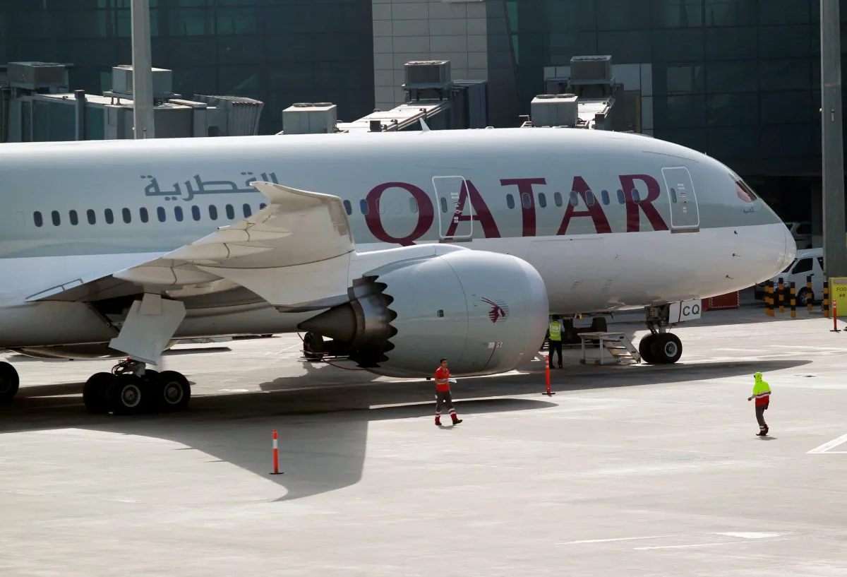 A Qatar Airways aircraft is seen at Hamad International Airport in Doha, Qatar on June 7, 2017. (REUTERS/Naseem Zeitoon)