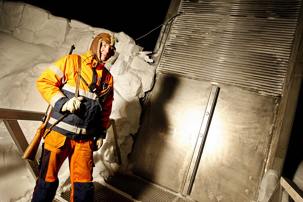 An armed guard stands outside the entrance to a seed vault near Longyabyen on Feb. 24, 2008. (Hakon Mosvold Larsen/AFP/Getty Images)