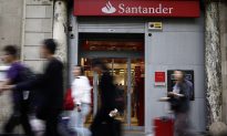 Santander Posts 11-Billion-Euro Loss for First Half, Confident About Outlook