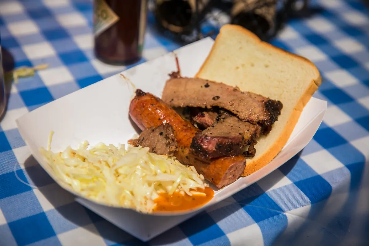 Brisket with sausage and sesame coleslaw from Salt Lick BBQ. (Benjamin Chasteen/The Epoch Times)