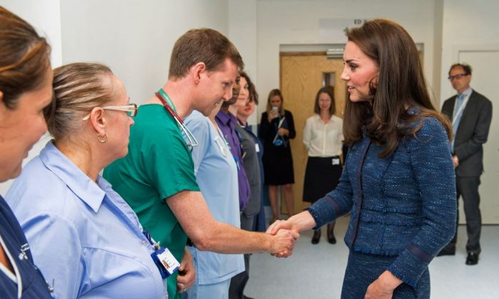 Britain's Catherine, Duchess of Cambridge (R), speaks to Dr Mark Haden as she visits Kings College Hospital to meet staff and patients affected by the terrorist attacks at London Bridge and Borough Market on June 3, in south London on June 12, 2017. (DOMINIC LIPINSKI/AFP/Getty Images)
