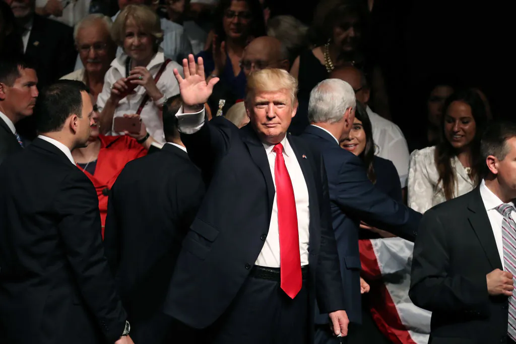 President Donald Trump waves after speaking about policy changes he is making toward Cuba at the Manuel Artime Theater in the Little Havana neighborhood on June 16, 2017 in Miami, Florida. (Photo by Joe Raedle/Getty Images)