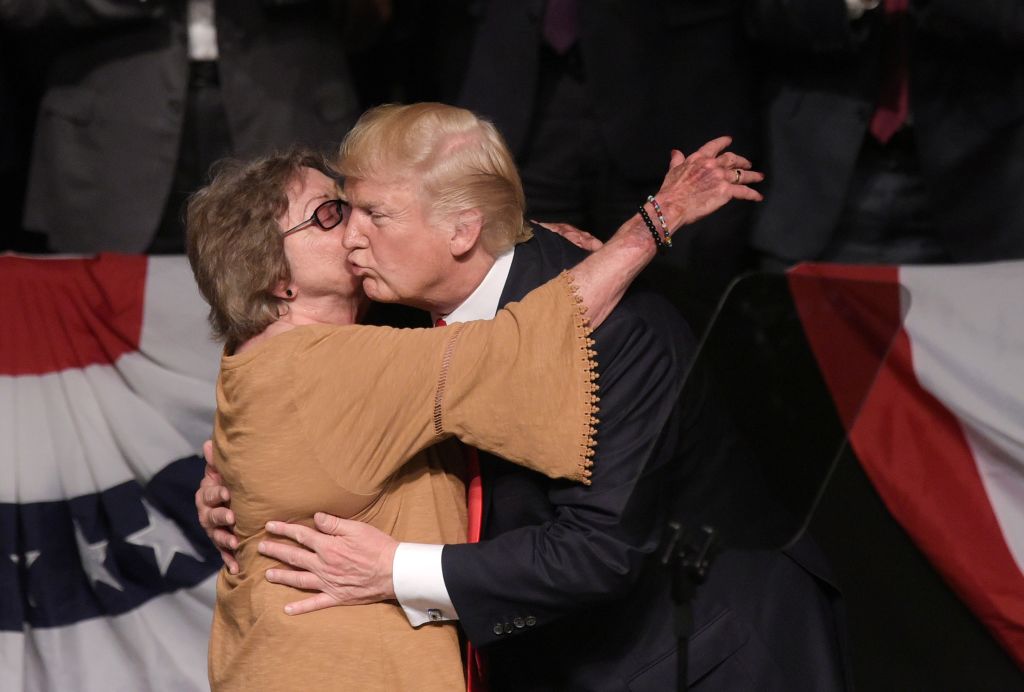 President Donald Trump hugs Cuban dissidents Cary Roque as he speaks at the Manuel Artime Theater in Miami, Florida on June 16, 2017. (MANDEL NGAN/AFP/Getty Images)
