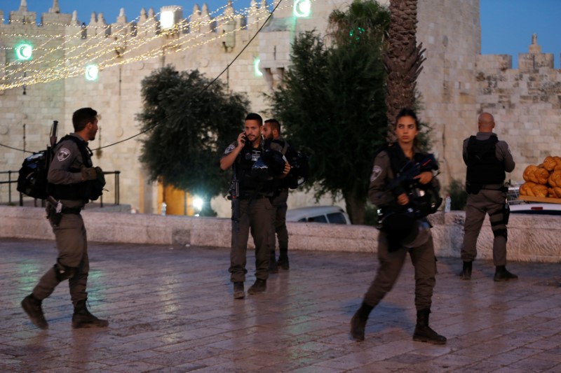 Israeli policemen secure the scene of the shooting and stabbing attack outside Damascus gate in Jerusalem's old city June 16, 2017. REUTERS/Ammar Awad