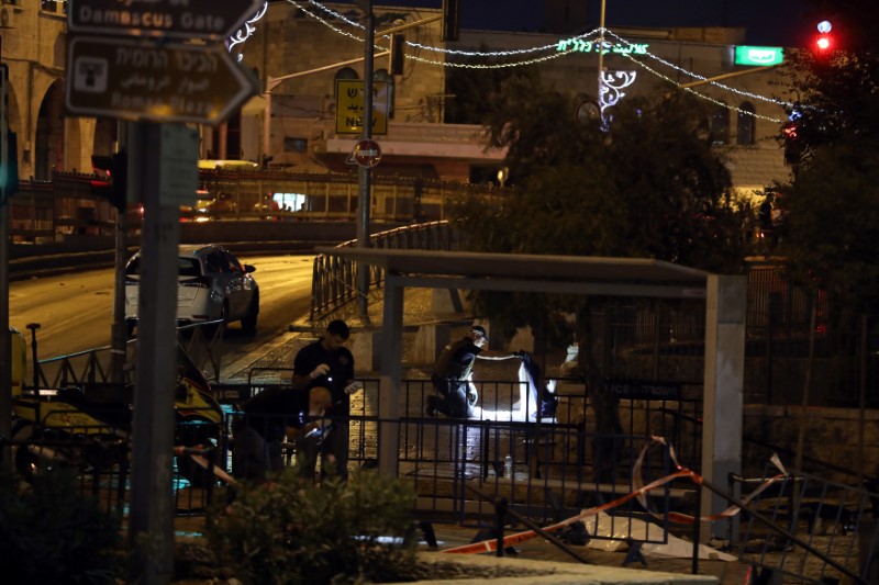 Israeli policemen examine the scene of the shooting and stabbing attack outside Damascus gate in Jerusalem's old city on June 16, 2017. (REUTERS/Ammar Awad TPX IMAGES OF THE DAY)