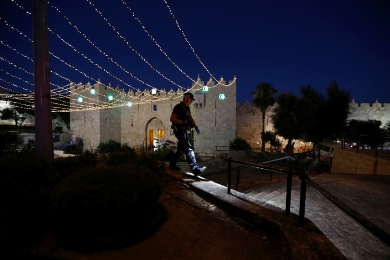 An Israeli policeman securse the scene of the shooting and stabbing attack outside Damascus gate in Jerusalem's old city June 16, 2017. REUTERS/Ammar Awad