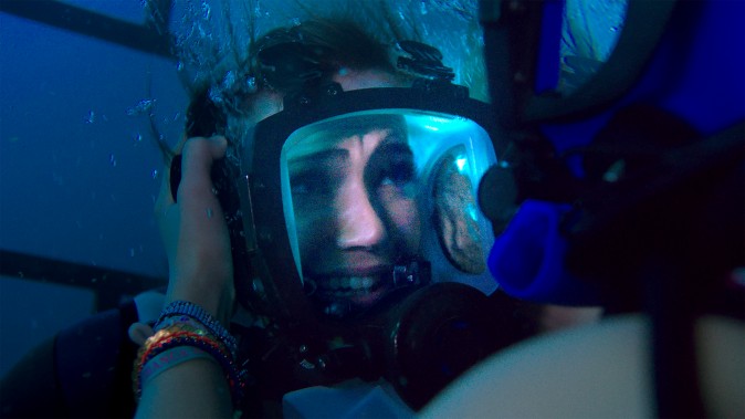 Kate (Claire Holt) tries to calm her panicked sister Lisa (Mandy Moore) after they realize they're trapped at the bottom of the ocean  in 