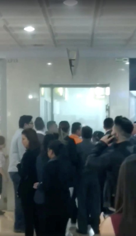 People are seen inside a shopping center after a blast took place, in Bogota, Colombia, June 17, 2017 in this still image from video obtained from social media. (Juan Dario via Reuters)