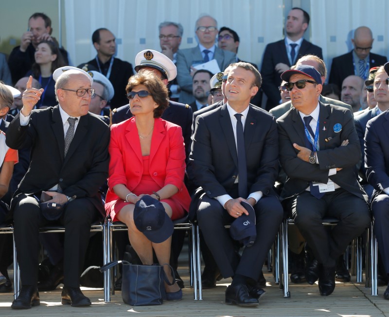 French President Emmanuel Macron (2ndR), French defense minister Sylvie Goulard (2ndL), Dassault Aviation CEO Eric Trappier (R) and French Foreign Affairs minister Jean-Luc Le Drian watch demonstration flights as part of the inauguration of the 52nd Paris Air Show in Le Bourget, north of Paris, France, June 19, 2017.   REUTERS/Michel Euler/Pool