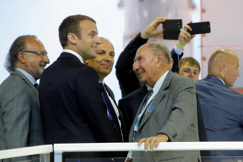 French President Emmanuel Macron (2nd L) talks with Dassault Aviation CEO Eric Trappier (C) in front of Serge Dassault (2nd R), Chairman and CEO of Dassault Group, during a visit at the Paris Air Show in Le Bourget, north of Paris on June 19, 2017. (Michel Euler/Pool/Reuters)