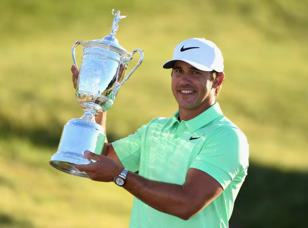 Brooks Koepka celebrates with the champion's trophy after the final round of the 2017 U.S. Open at Erin Hills in Hartford, Wisconsin on June 18, 2017. (Ross Kinnaird/Getty Images)